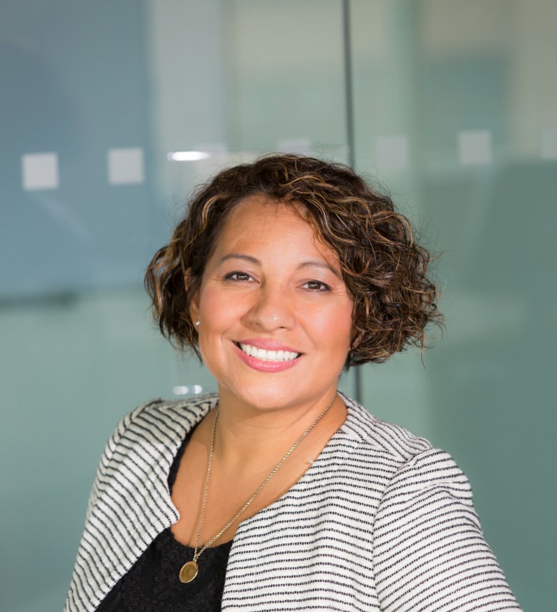 Maya Ellison smiling in the office