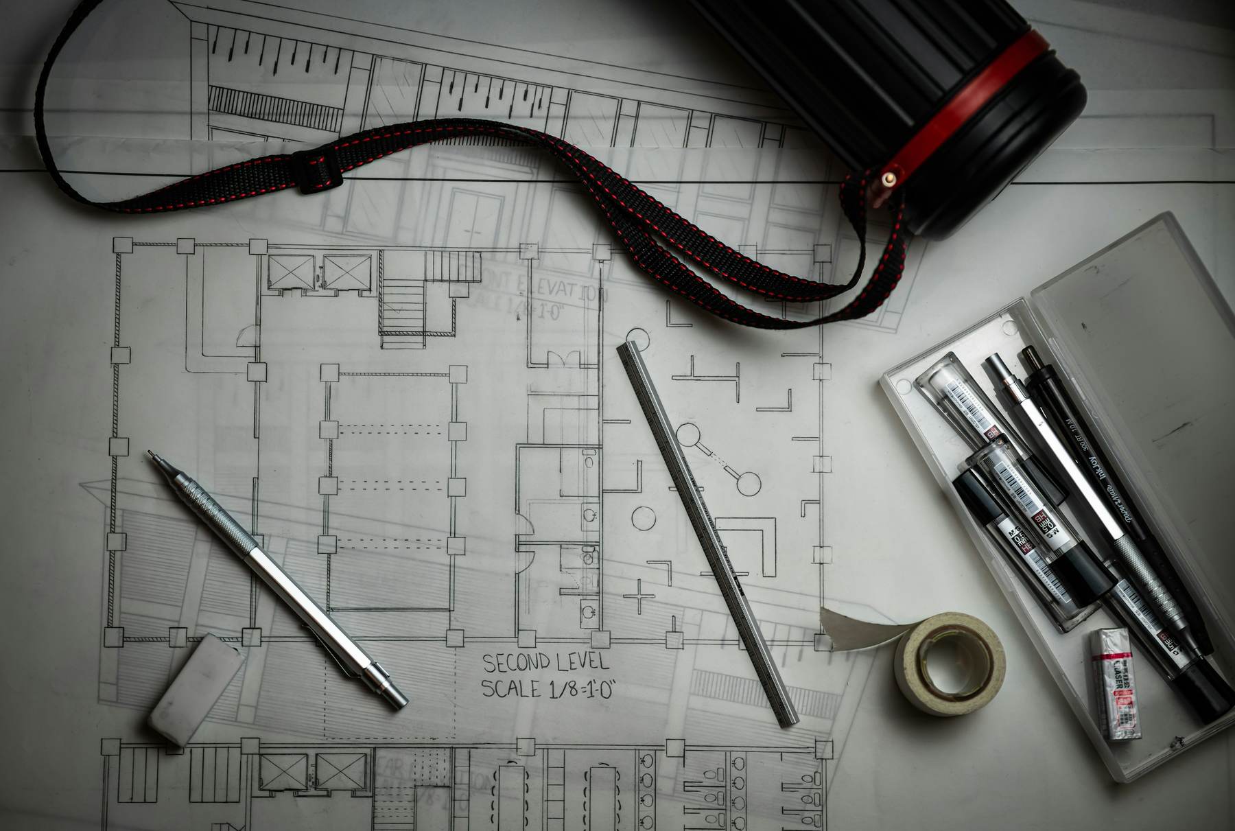 Construction drawings and drafting tools on a table