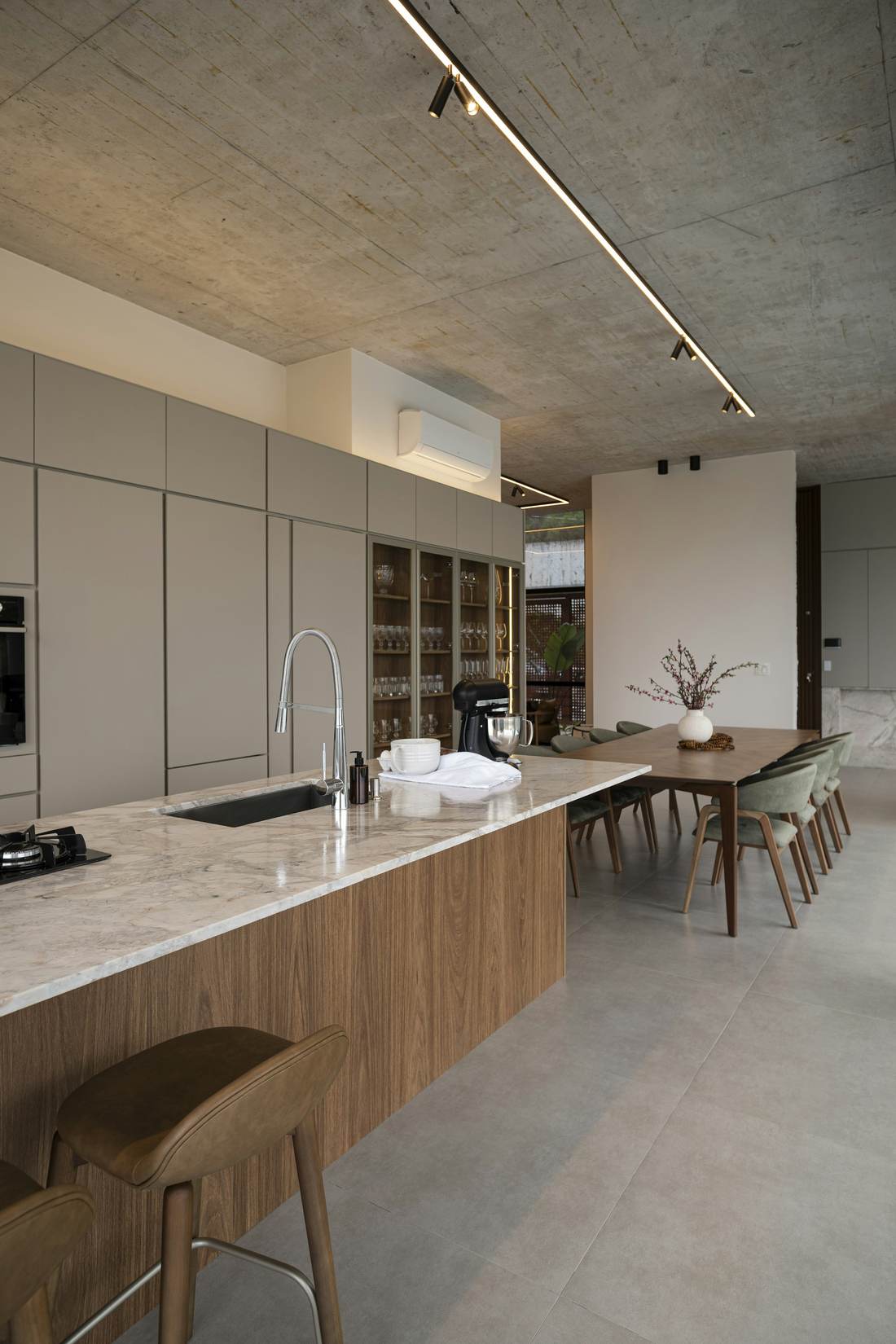 Finished kitchen with timber and concrete in soft light