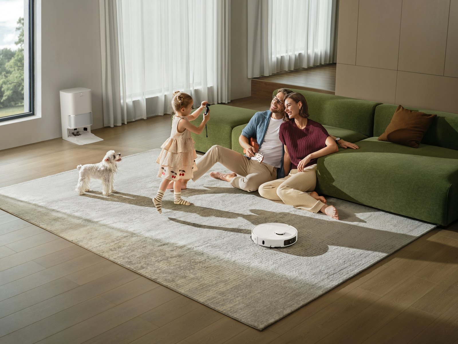 A family and their small dog relaxing on a sunny living room floor