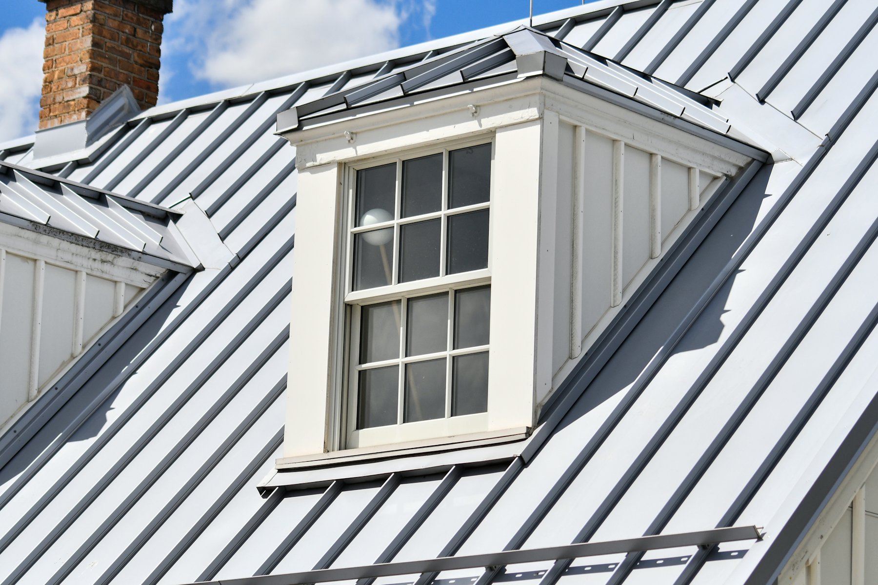 Standing seam metal roof with a dormer window