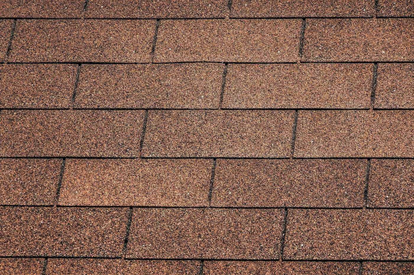 Close-up of overlapping asphalt shingles